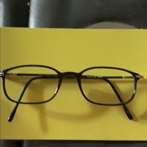 Black frame eyeglasses with silver accents. Light